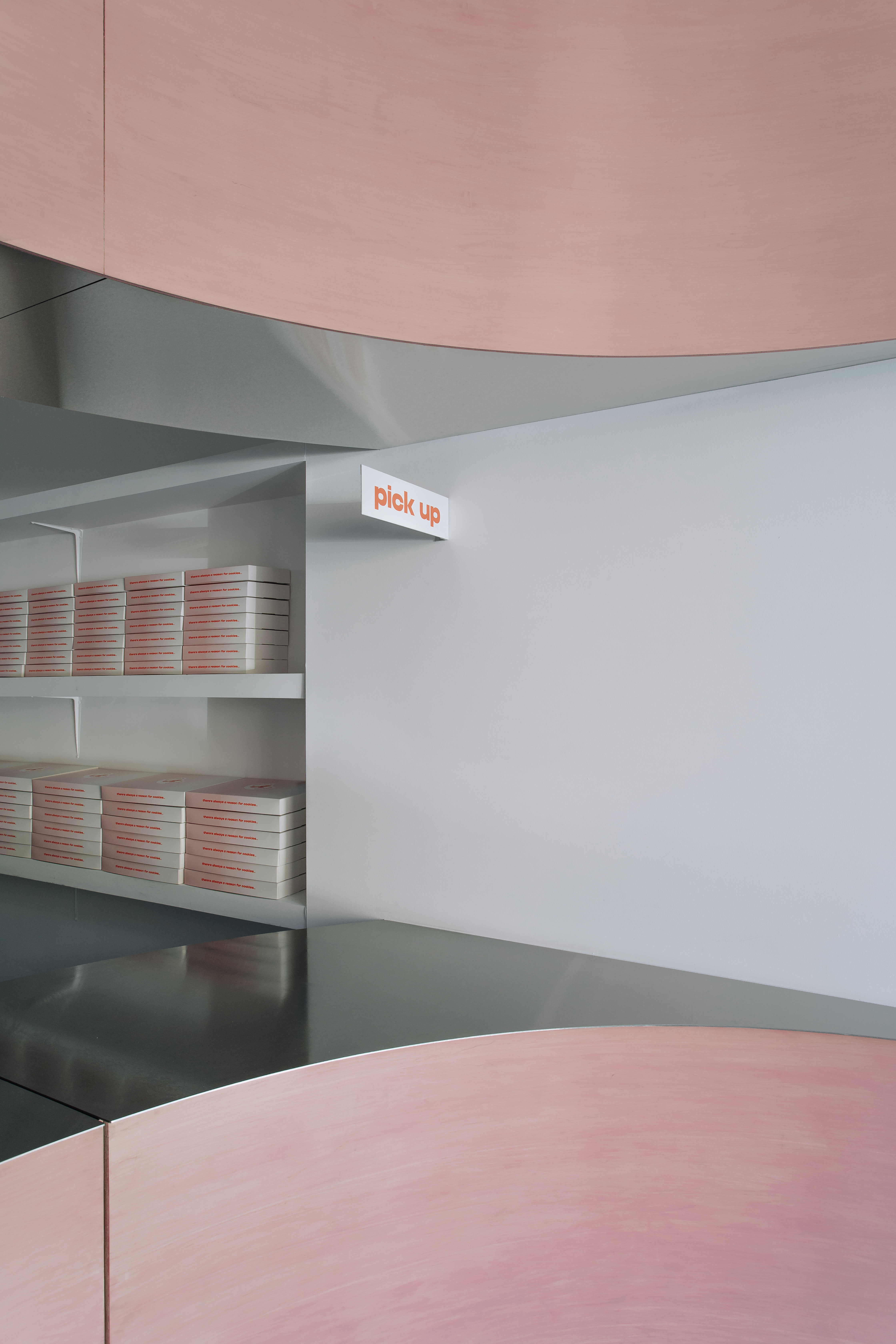 Pickup shelves and pink curves at Andrea's Cookies, Toronto
