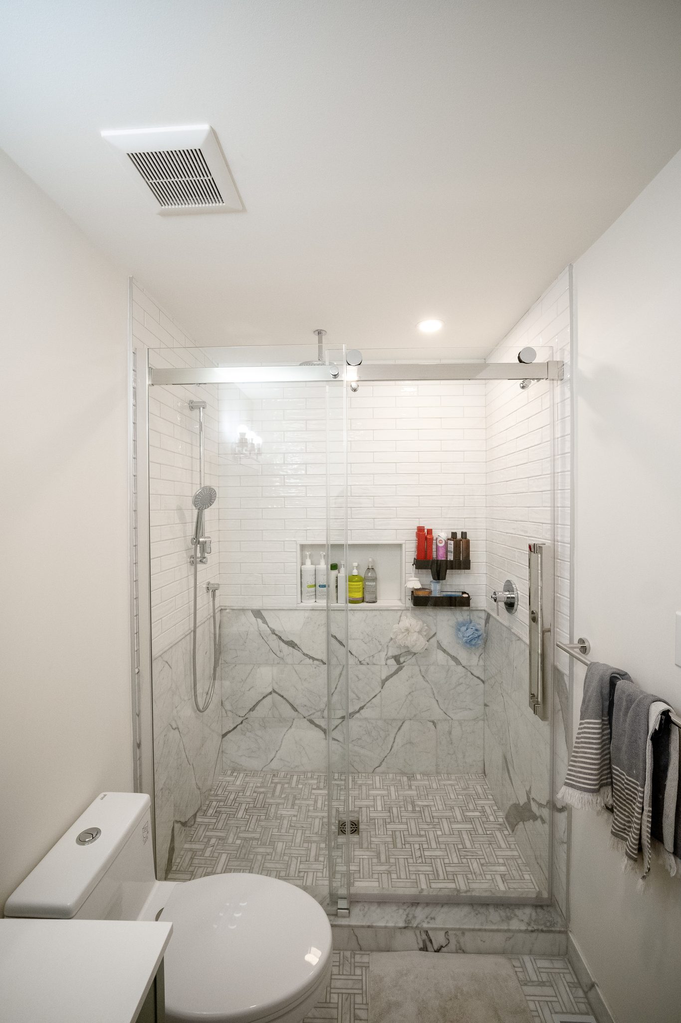 Frameless glass walk-in shower, High Park renovation, Toronto