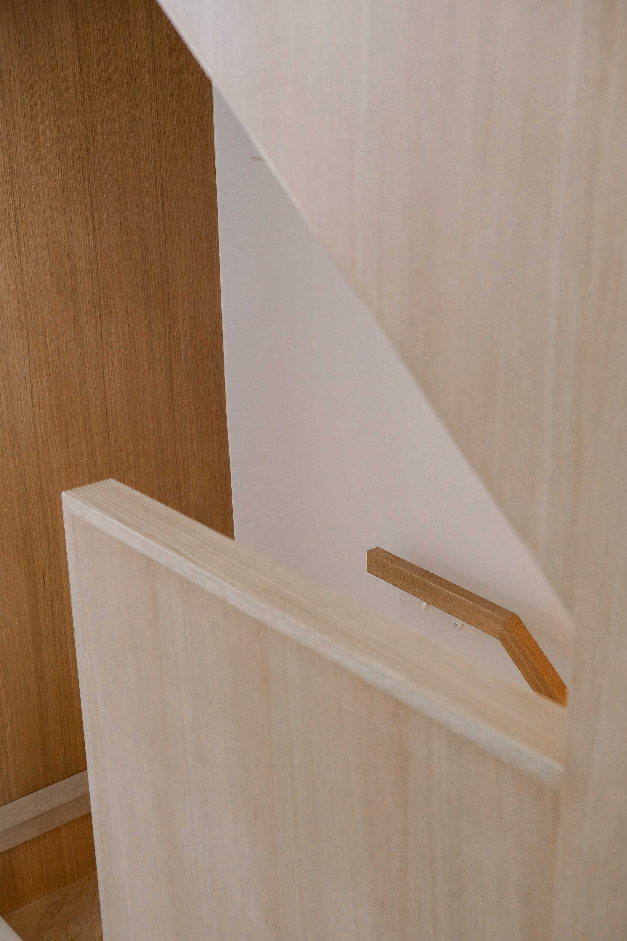 White oak staircase millwork at Junction House, Toronto, built by Doty Construction